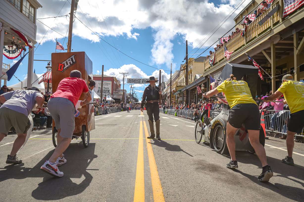 Teams race custom-built outhouses down historic C Street.
