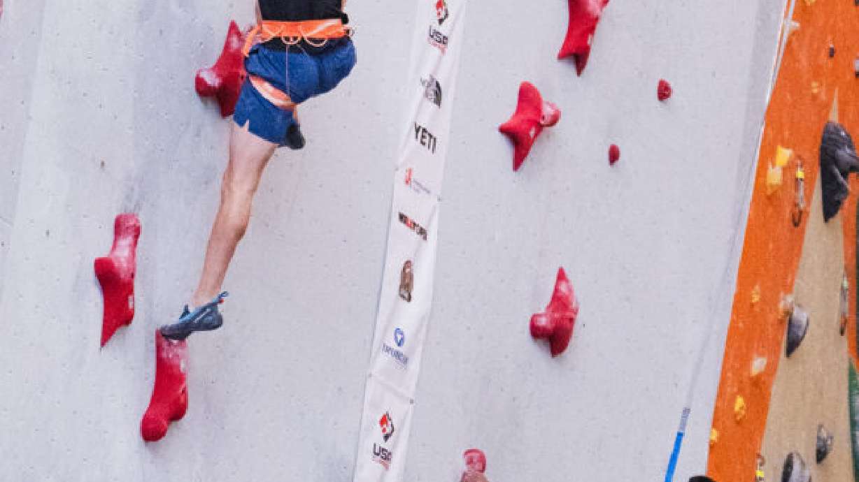 U student Logan Miner competes in the 15-meter advanced men’s speed final at the USA Climbing Collegiate National Championships. Miner placed first, with a time of 5.59 seconds.