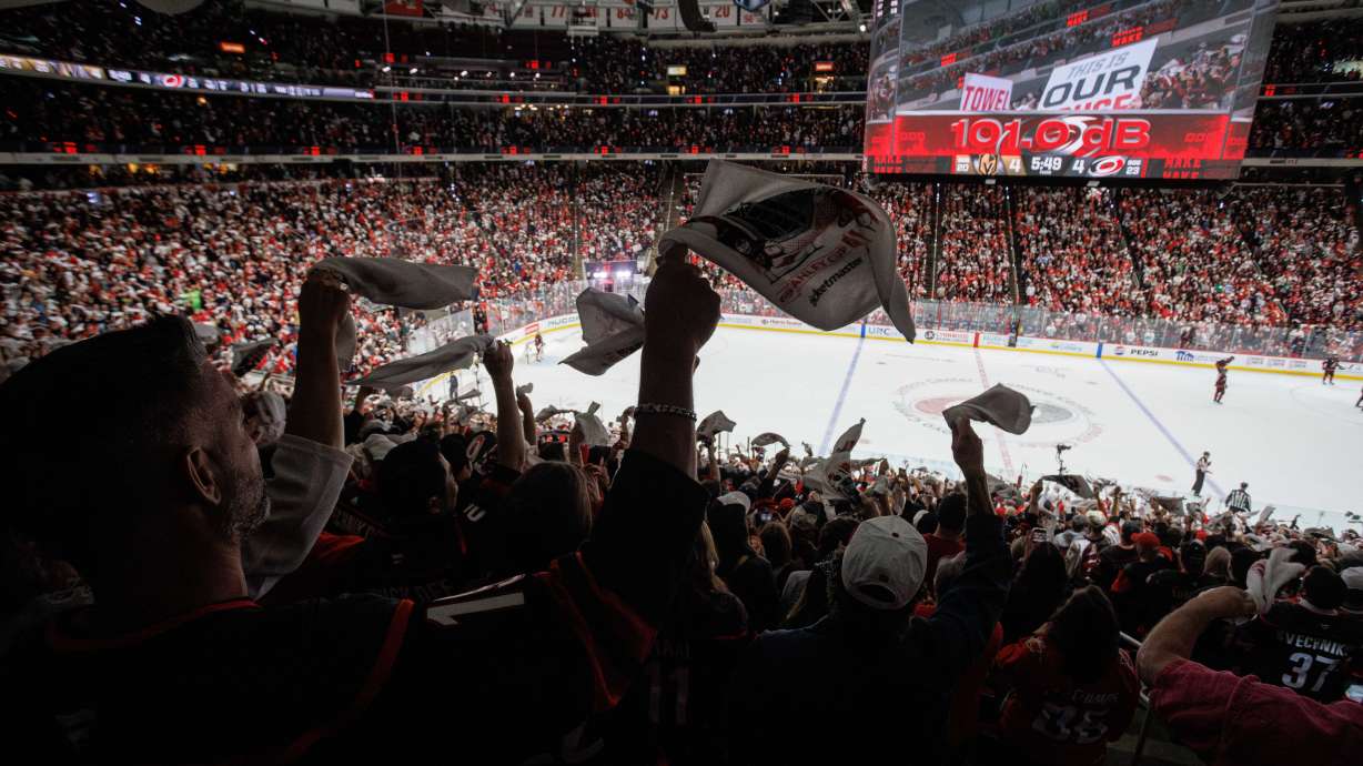 Fans at the Lenovo Center wave towels late in the third period in Game 1 of the NHL hockey Stanley Cup Final series between the Carolina Hurricanes and the Vegas Golden Knights in Raleigh, N.C., Tuesday, June 2, 2026.