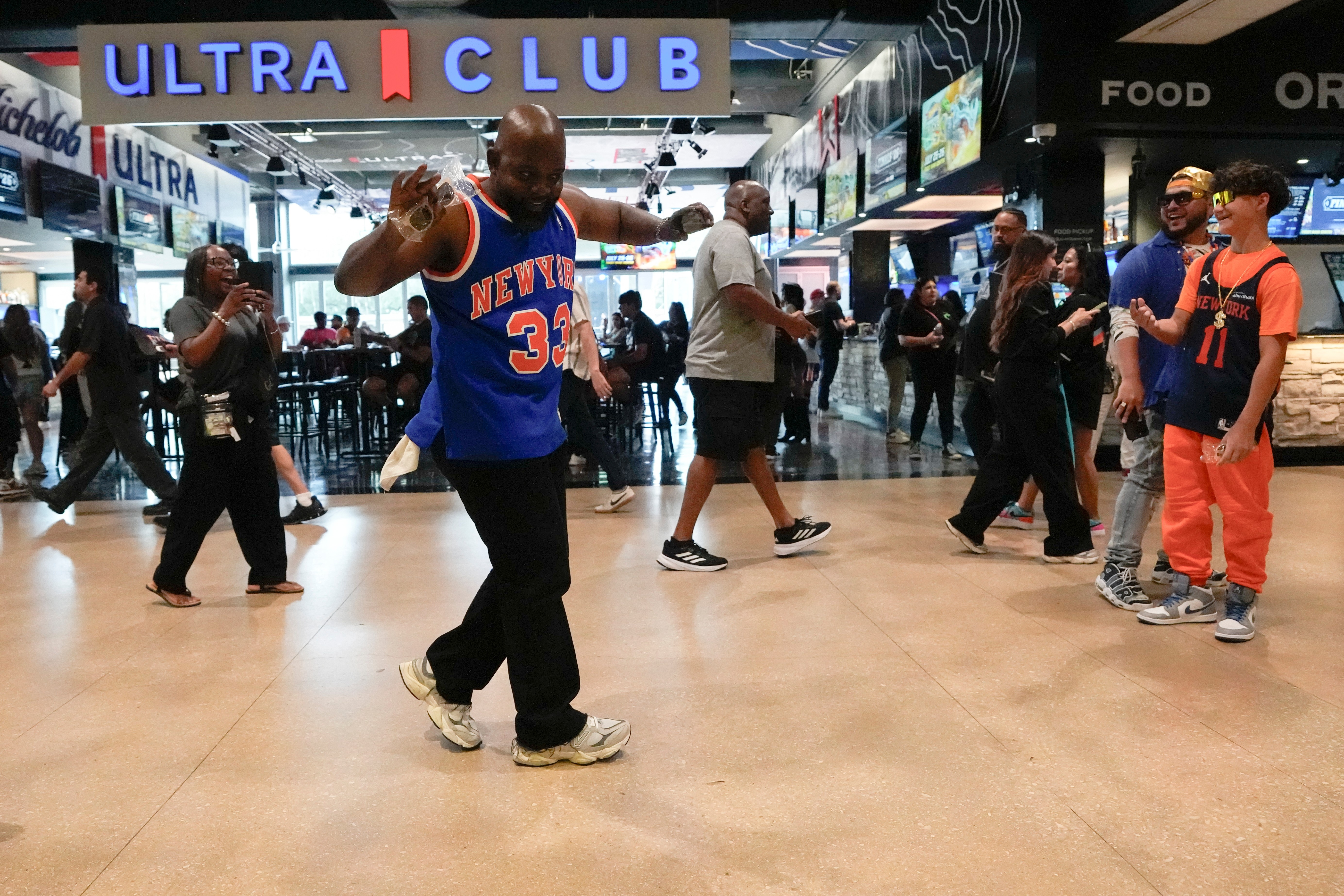 A New York Knicks fan arrives prior to Game 1 of the NBA Finals basketball series against the San Antonio Spurs, Wednesday, June 3, 2026, in San Antonio.