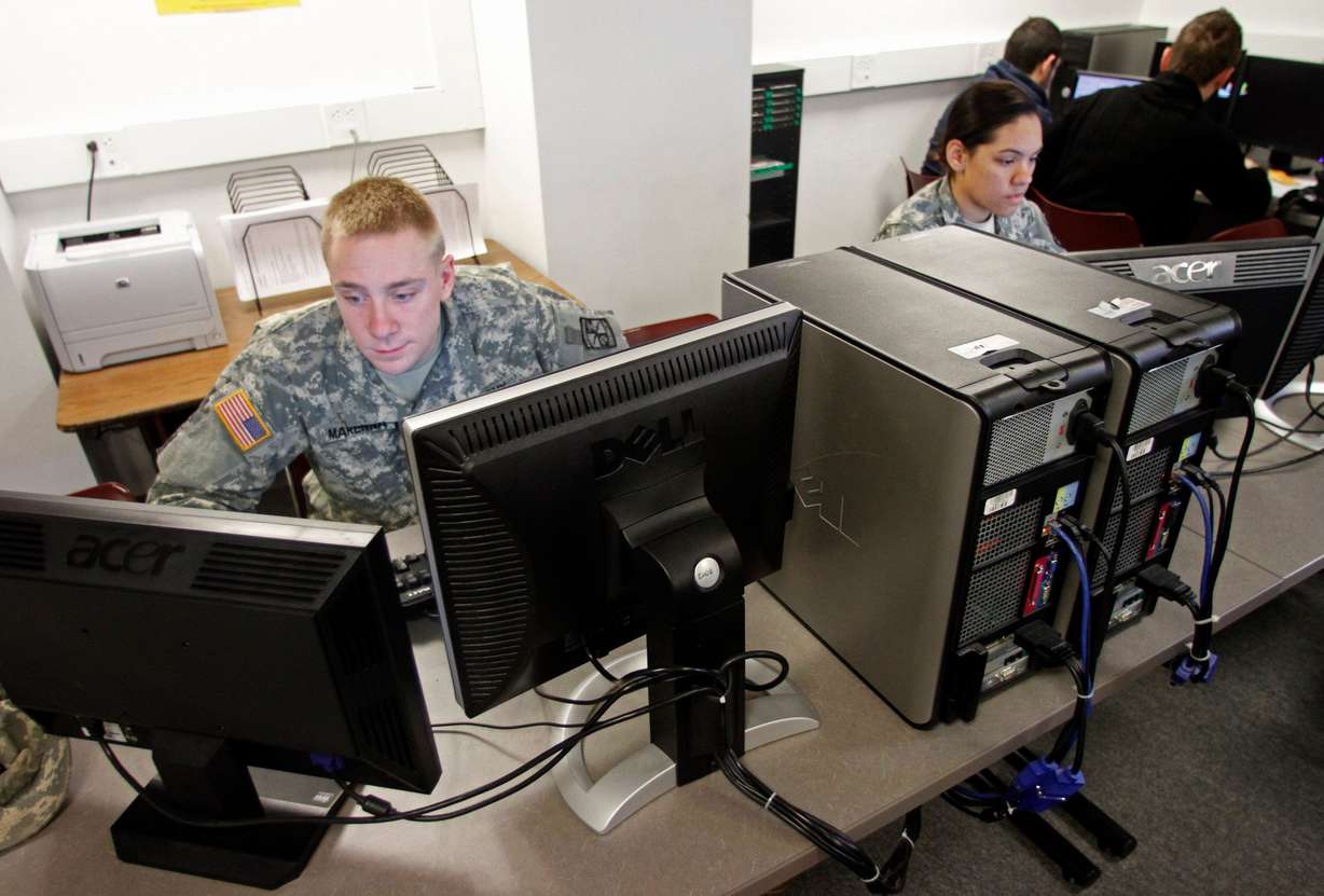 In this March 8, 2012 photo, Norwich University student Adam Marenna, of Belair, Md., works on computers in Northfield, Vt. Deep in the bowels of a building on the campus of the nation's oldest private military academy, students from across the globe are being taught to fight the war of the future. In a six-week seminar nearing its end, students take turns building and defending computer networks, attacking one or monitoring the operation. The technical training is only a part of the skills needed to protect computer networks from probes that could allow an attacker full access to a target computer.