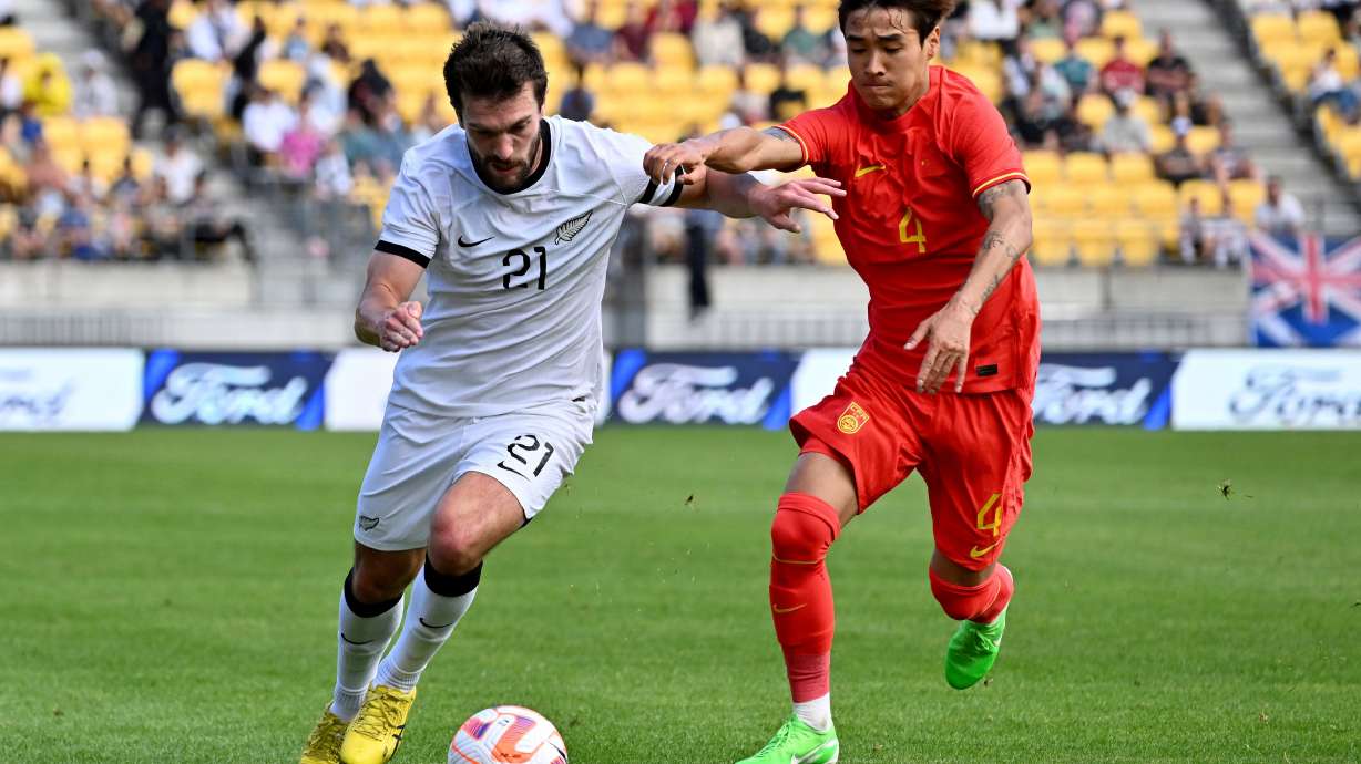 FILE - Tim Payne, left, of the All Whites and Shihao Wei of China compete for the ball during the international soccer friendly between New Zealand and China in Wellington, New Zealand, Sunday, March 26, 2023.