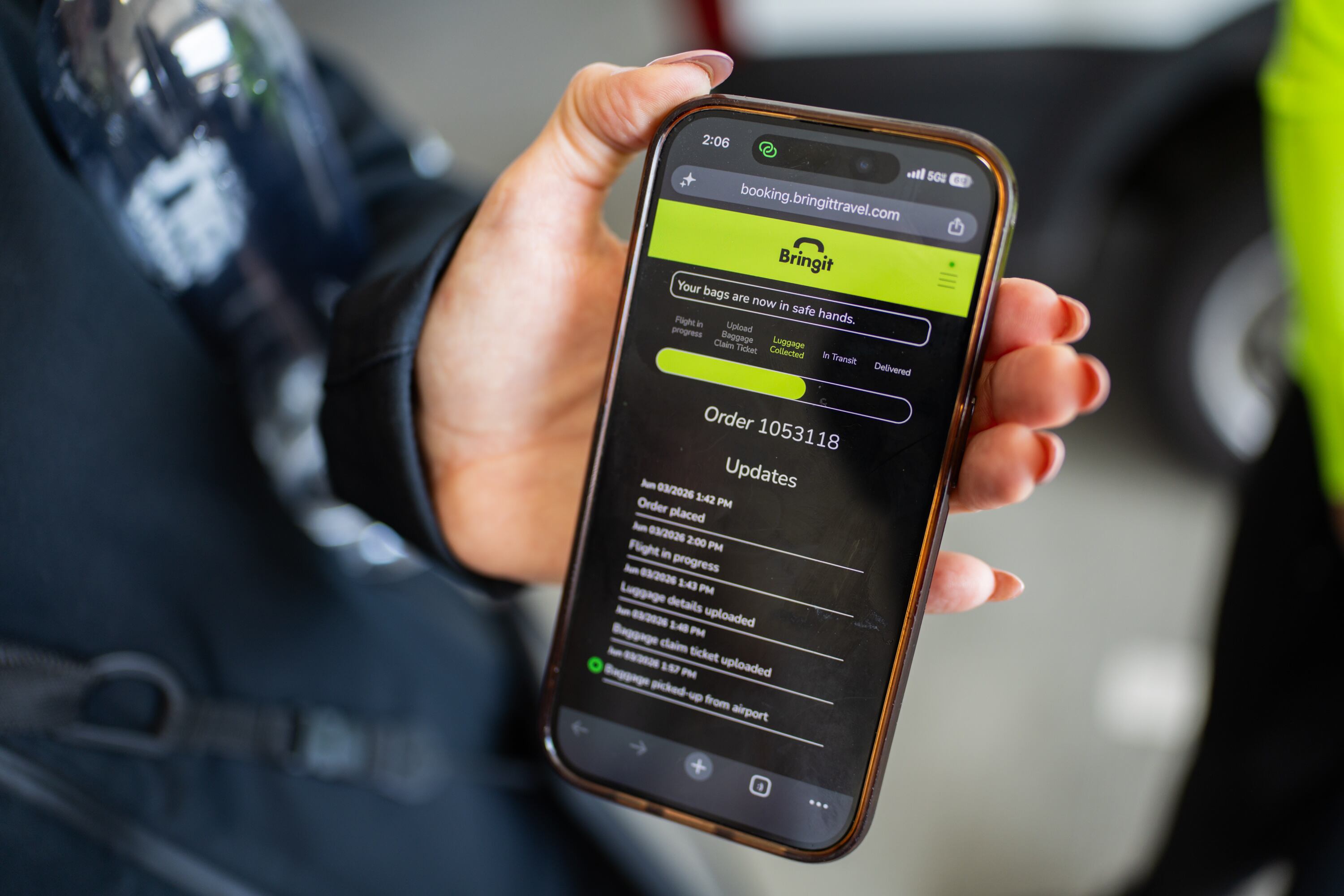Jenn Blackham, co-founder, chief business officer and head of operations of Bringit, demonstrates to the Deseret News how a customer views the luggage delivery service on their website at Salt Lake City International Airport on Wednesday. The company calls itself "the DoorDash of luggage."