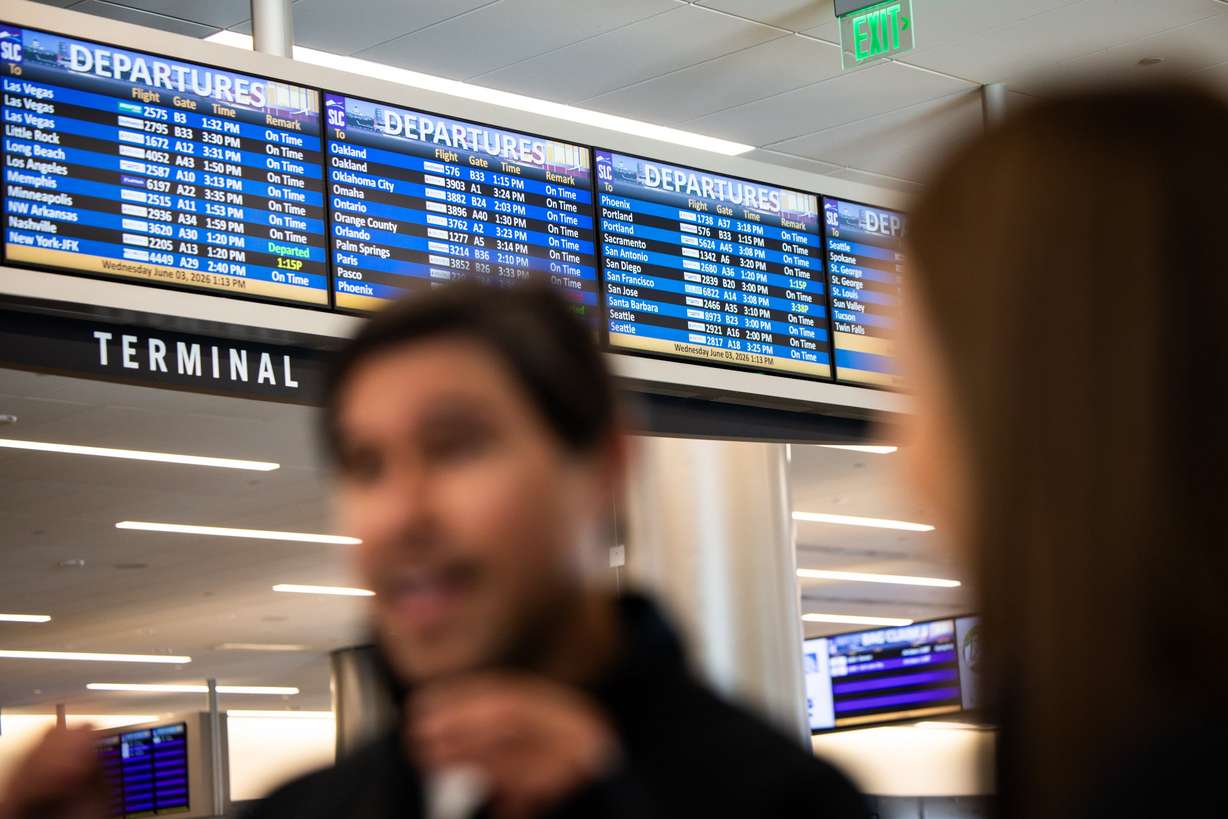 Israel Arellano, co-founder, CEO and head of product at Bringit, and Jeanette Lee, co-founder and chief commercial officer of Bringit, talk to the Deseret News at Salt Lake City International Airport on Wednesday. Bringit is a company that provides an on-demand, same-day luggage delivery to hotels, rentals and residences in Salt Lake City and Park City.