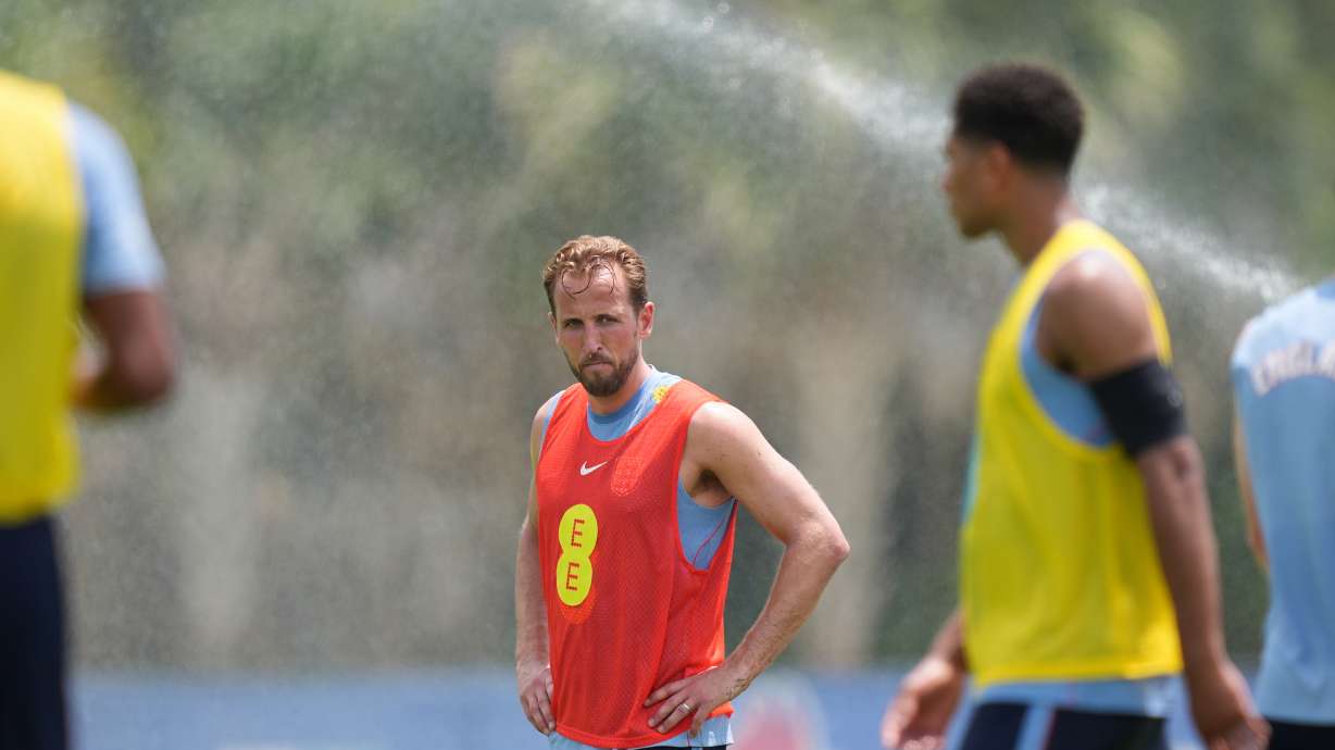 England forward Harry Kane stands near sprinklers during a training session for the national soccer team in Palm Beach Gardens, Fla., Tuesday, June 2, 2026, ahead of the World Cup soccer tournament.