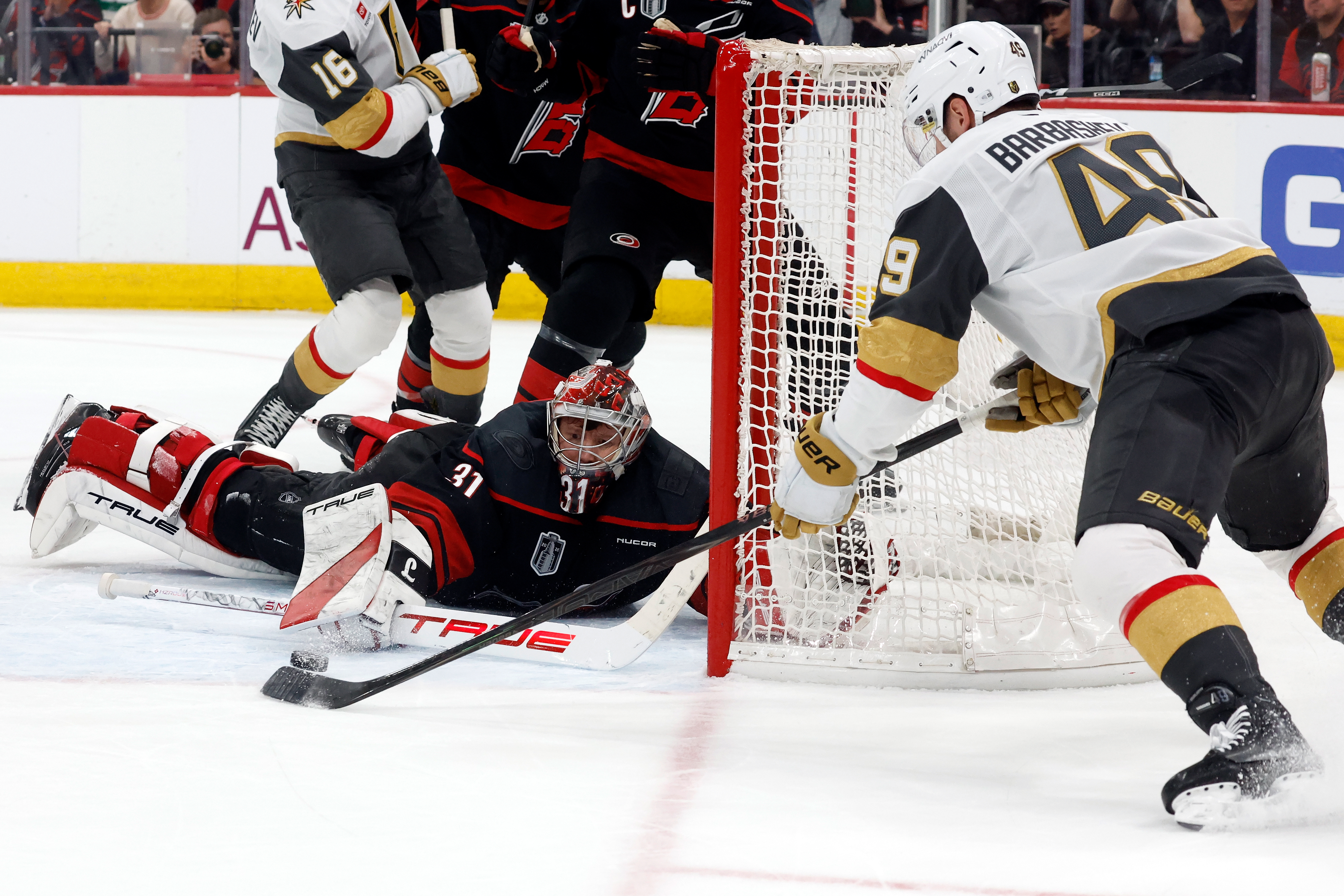 Carolina Hurricanes goaltender Frederik Andersen (31) stops a shot byf Vegas Golden Knights' Ivan Barbashev (49) during the third period in Game 2 of the NHL hockey Stanley Cup Final series in Raleigh, N.C., Thursday, June 4, 2026.