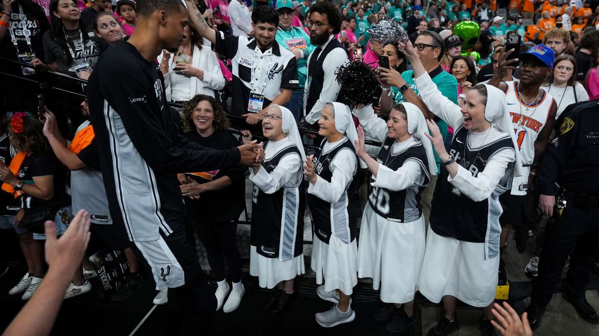 The Salesian Sisters greet players prior to Game 1 of the NBA Finals basketball series between the New York Knicks and the San Antonio Spurs, Wednesday, June 3, 2026, in San Antonio.