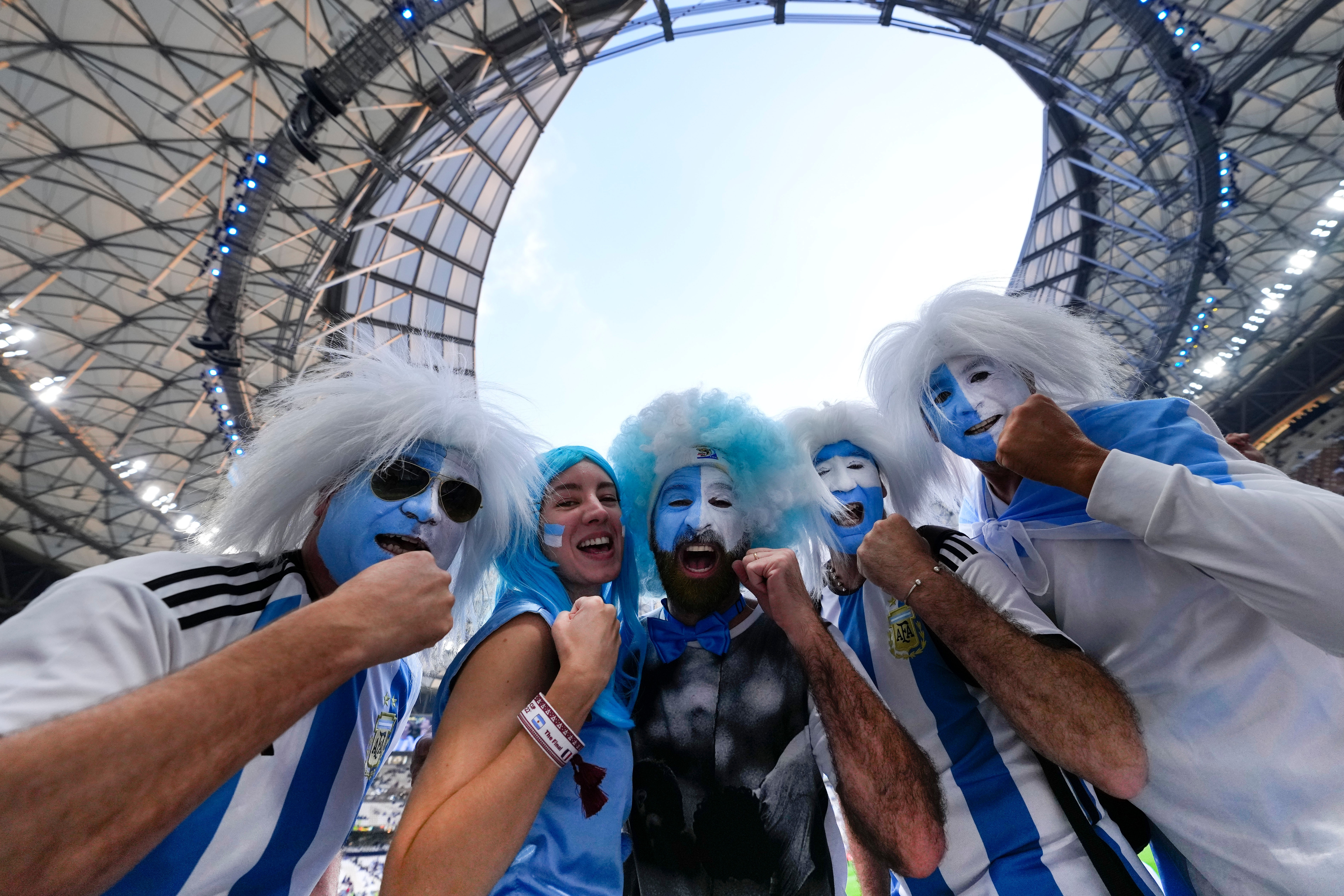 FILE - Argentinian fans cheer before the the World Cup final soccer match between Argentina and France at the Lusail Stadium in Lusail, Qatar, Dec. 18, 2022. 
