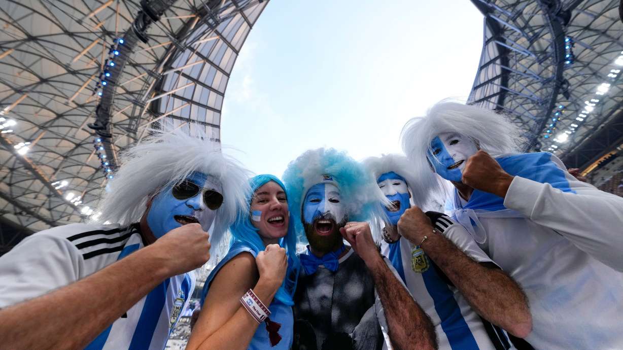 FILE - Argentinian fans cheer before the the World Cup final soccer match between Argentina and France at the Lusail Stadium in Lusail, Qatar, Dec. 18, 2022.