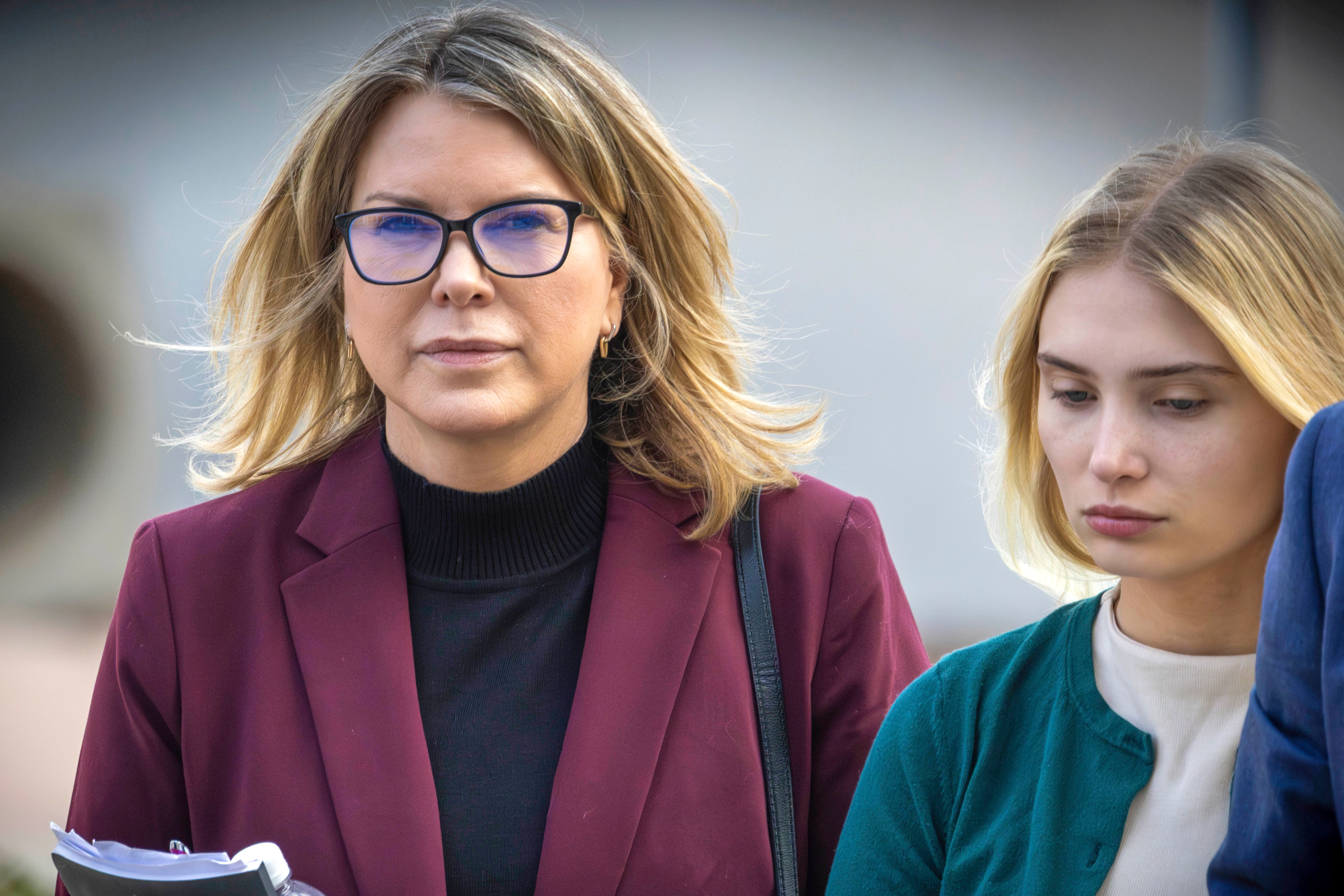 FILE - Rebecca Grossman, left, and her daughter head to Van Nuys Courthouse in the Van Nuys section of Los Angeles on Feb. 14, 2024. 