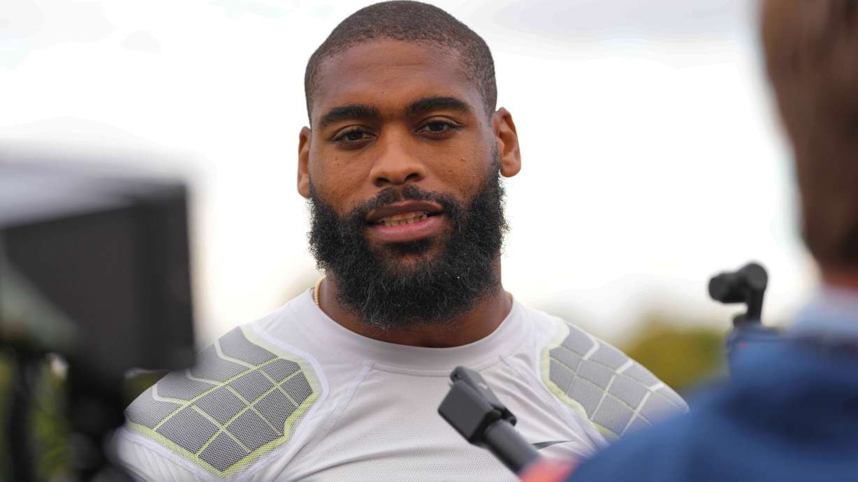 FILE - Denver Broncos' Jonathon Cooper speaks to the media at NFL football practice at Tottenham Hotspur training ground in London, Wednesday, Oct. 8, 2025.