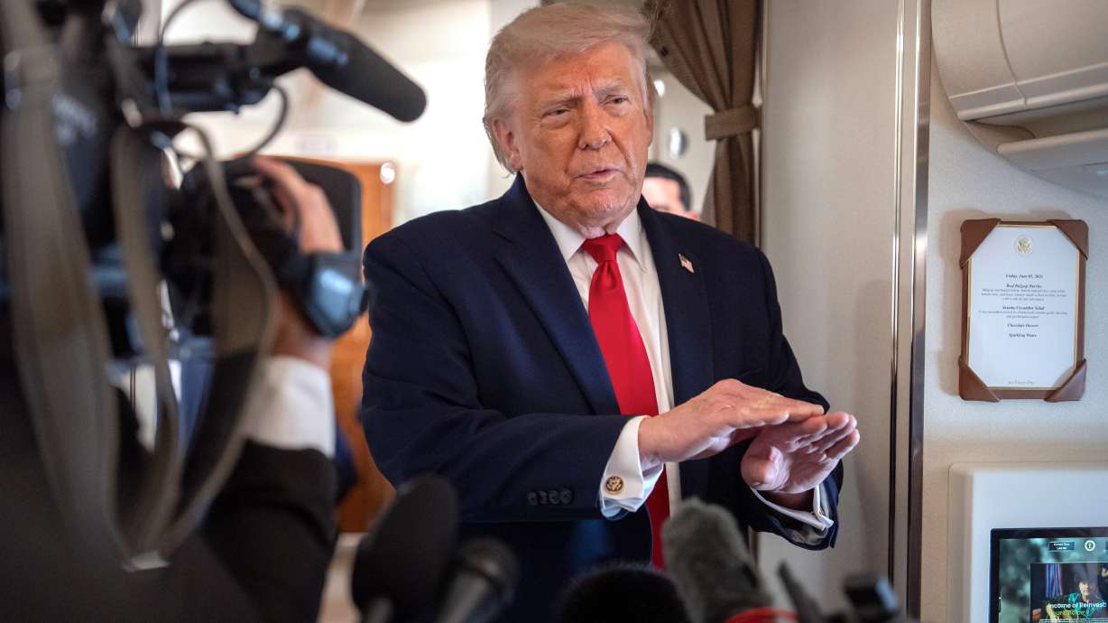 President Donald Trump speaks to reporters aboard Air Force One en route from Joint Base Andrews, Md., to Eau Claire, Wis., Friday, June 5, 2026.