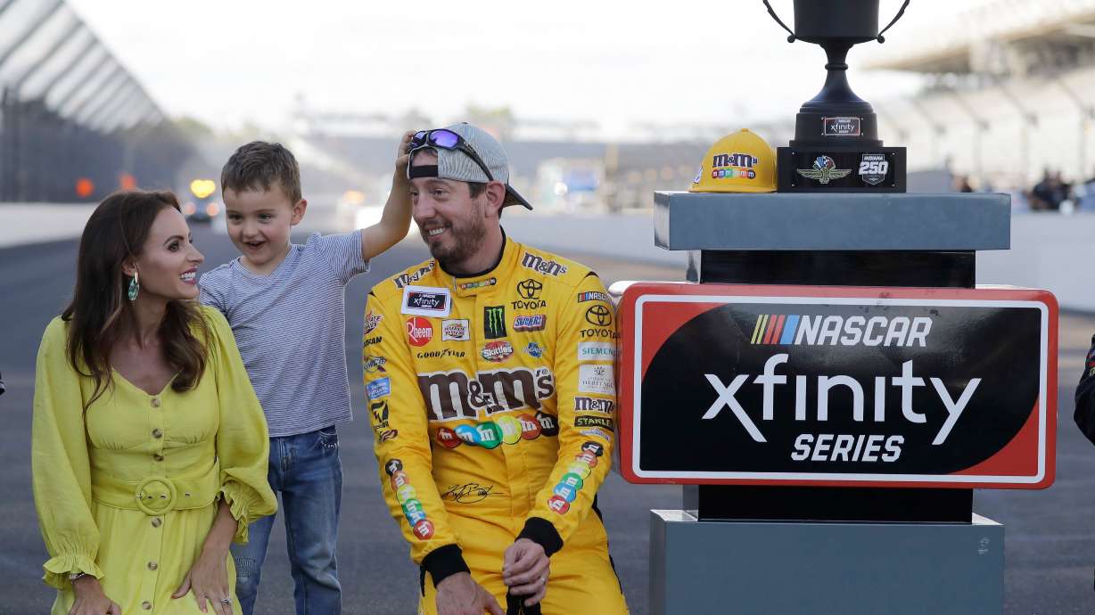 FILE - NASCAR Xfinity Series driver Kyle Busch celebrates with his wife, Samantha, and son, Brexton, after winning the NASCAR Xfinity auto race at the Indianapolis Motor Speedway, Sept. 7, 2019 in Indianapolis.