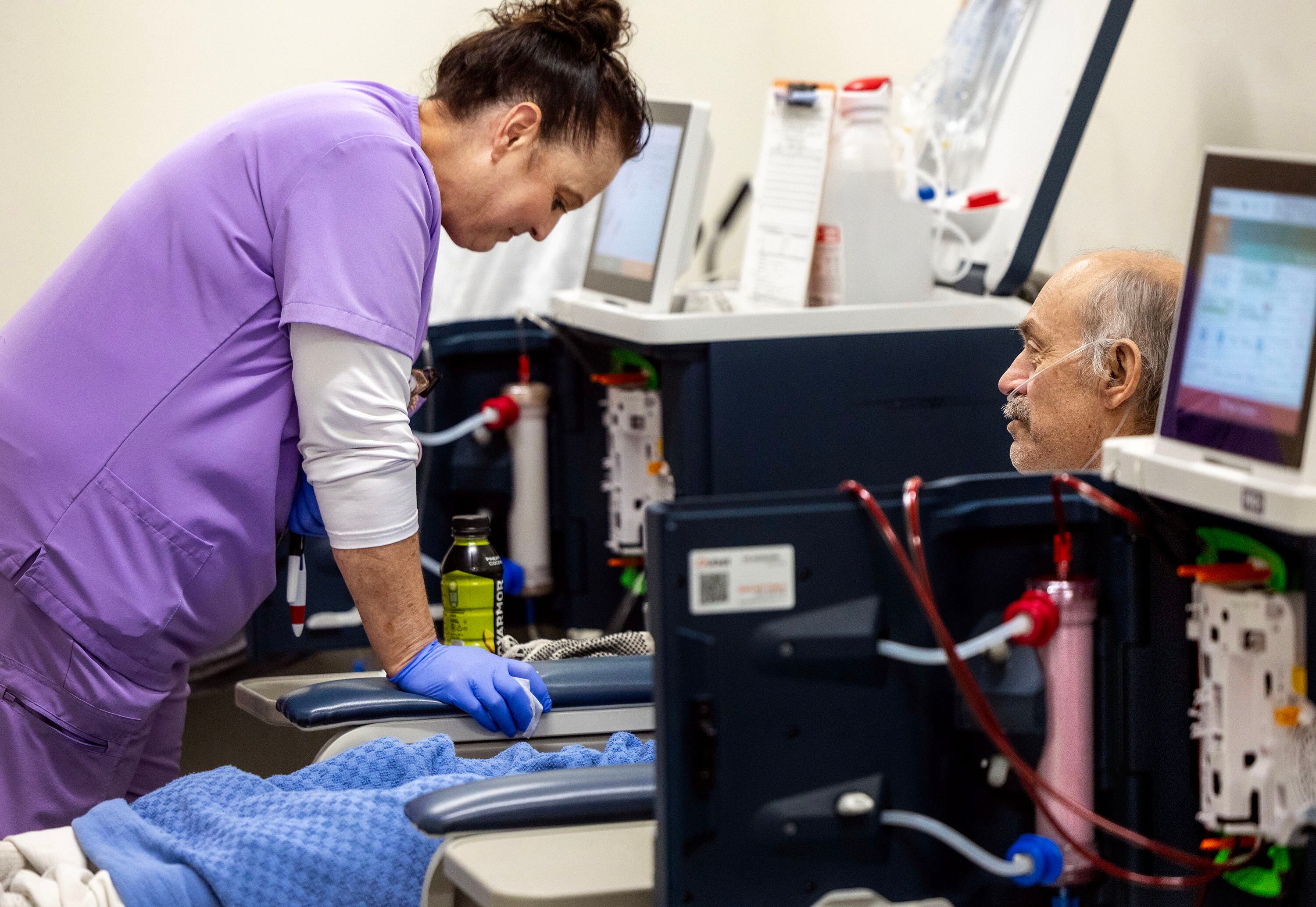 Cindy French speaks with Daniel Lassche during his dialysis treatment at the Utah State Correctional Facility in Salt Lake City on Wednesday. Lassche has been an inmate for 20 years and has been receiving treatment since he arrived.