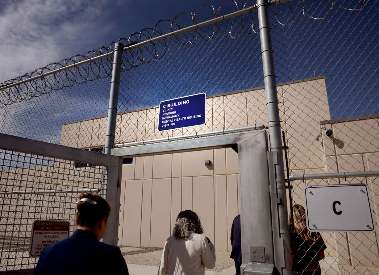 Tracy Gruber, Utah Department of Health and Human Services Commissioner, and others enter the C Building of the Utah State Correctional Facility in Salt Lake City on Wednesday. The facility purchased dialysis machines to treat inmates with kidney failure or kidney disease in prison.