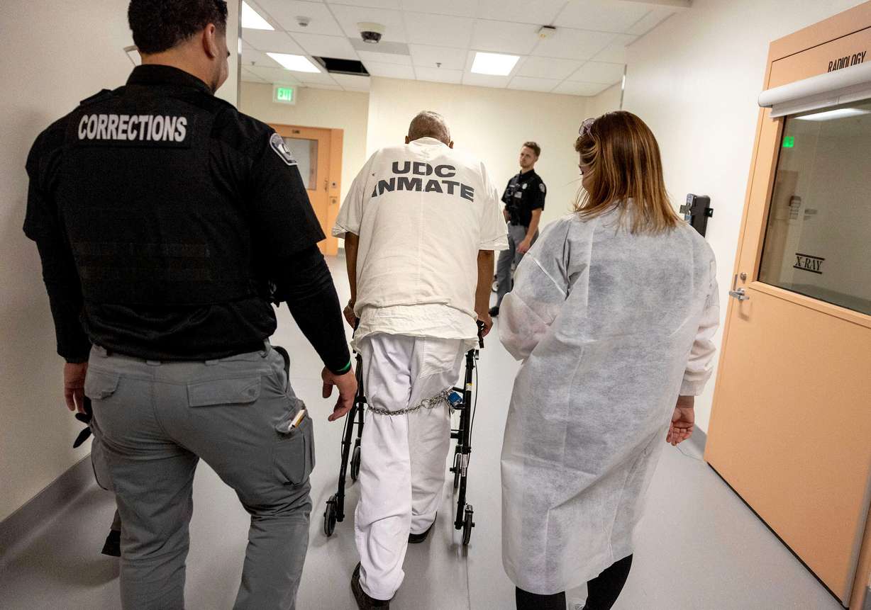 An inmate is escorted back to his cell following a dialysis treatment at the Utah State Correctional Facility in Salt Lake City on Wednesday. The in-house treatment avoids transportation to the University of Utah Hospital, what officials called a "high-risk operation."