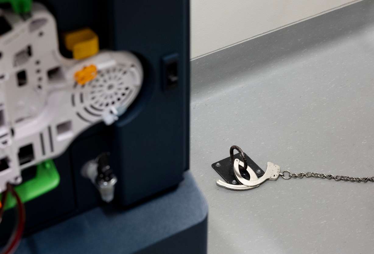 Handcuffs are chained to the floor during an inmate’s dialysis treatment at the Utah State Correctional Facility in Salt Lake City on Wednesday. Jillian Flinders said getting to administer treatments at the facility is the coolest experience she's had.