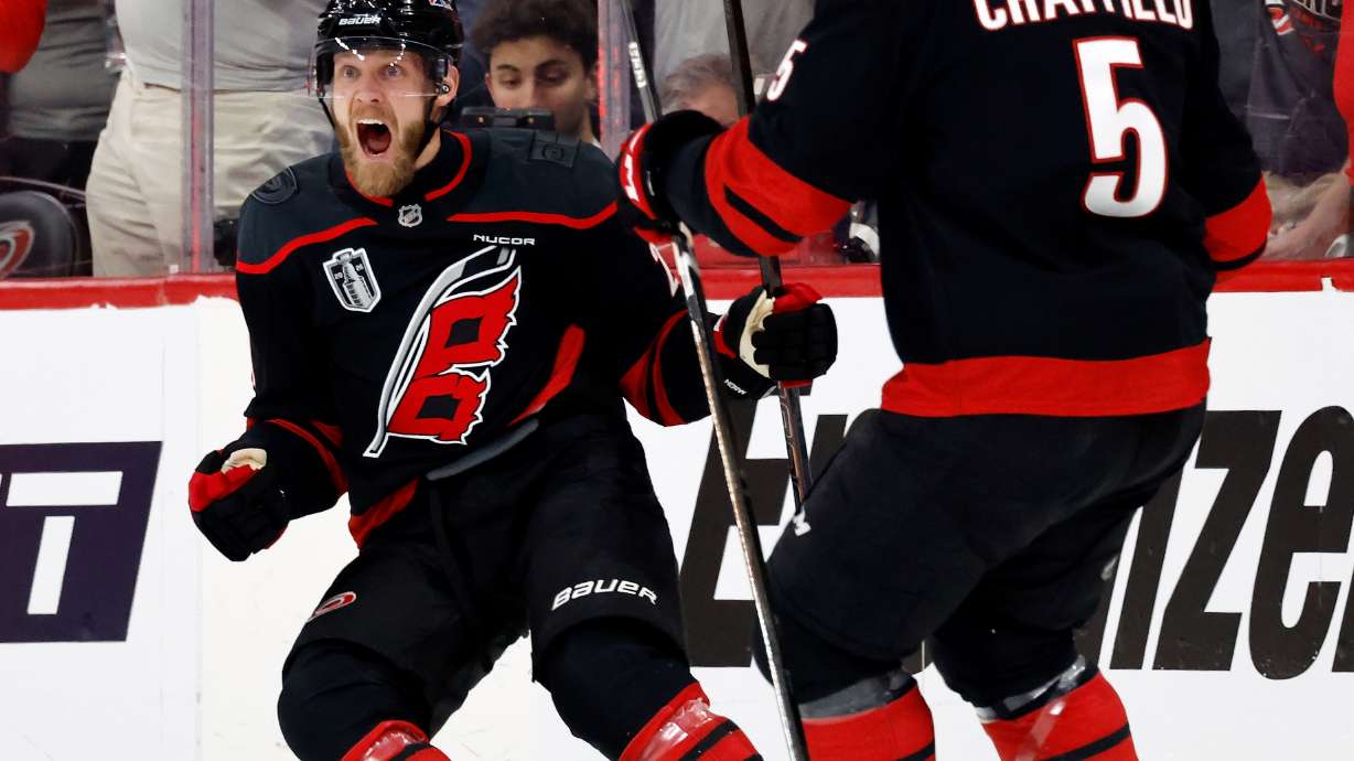Carolina Hurricanes' Nikolaj Ehlers (27) celebrates his goal with Jalen Chatfield (5) during the first period in Game 1 of the NHL hockey Stanley Cup Final series against the Vegas Golden Knights in Raleigh, N.C., Tuesday, June 2, 2026.