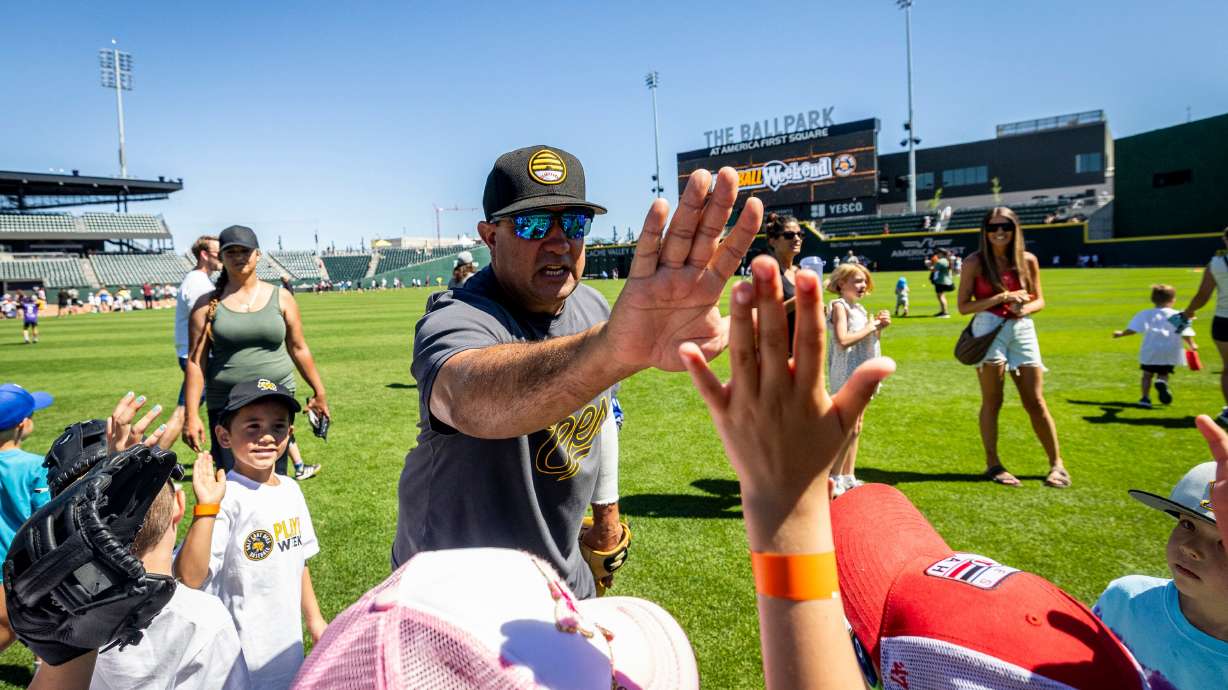 Salt Lake Bees first base coach Jack Santora high-fives youth participants at a kick-off event for Utah Youth Sports Giving Day at The Ballpark at America First Square in South Jordan on Friday. The campaign hopes to increase access for youth sports.