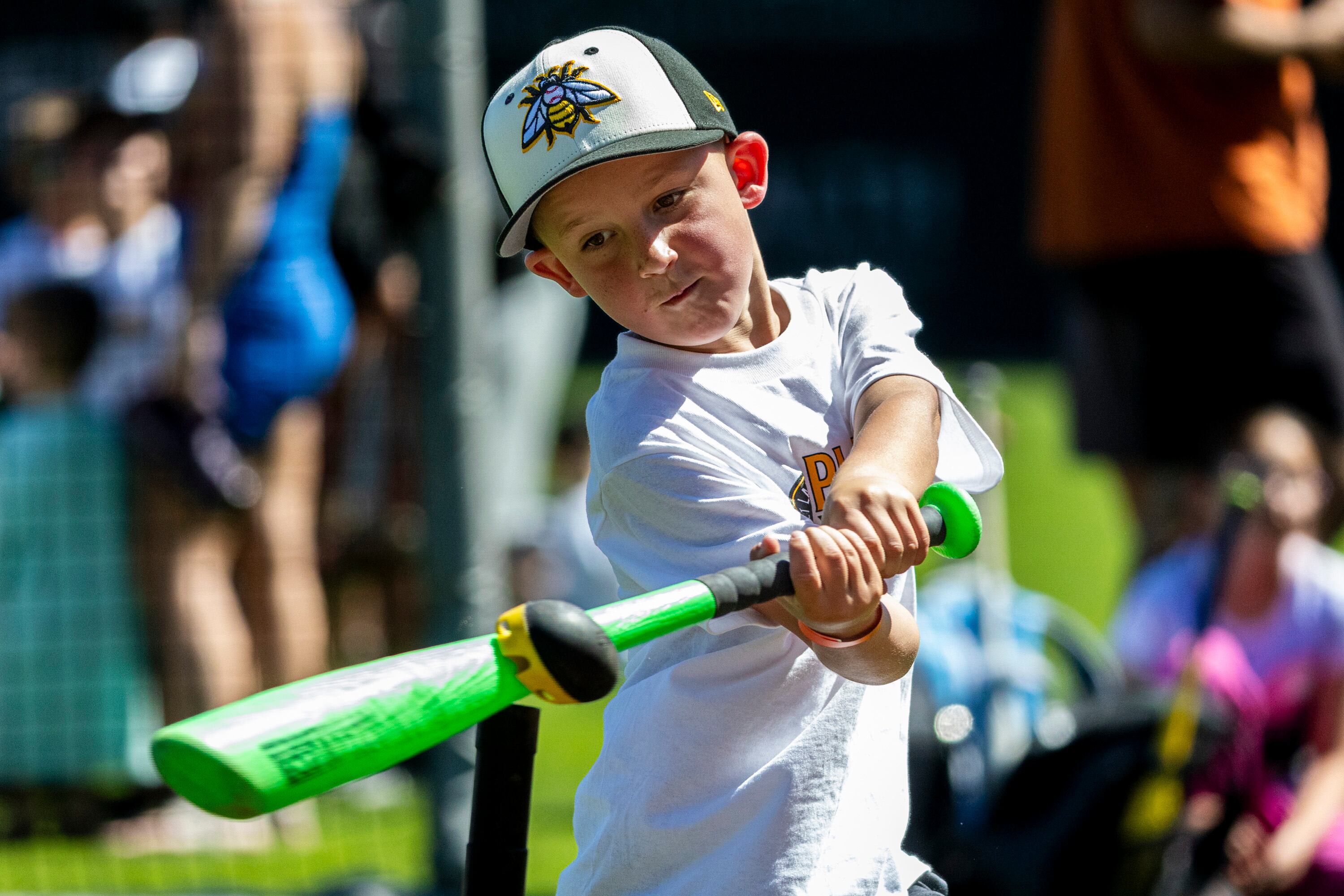 Steven Glasgow, 5, of Mapleton, connects with the ball as part of a T-ball activity during a kick-off event for Utah Youth Sports Giving Day held at The Ballpark at America First Square in South Jordan on Friday. The event looks to increase access for youth sports in the state.