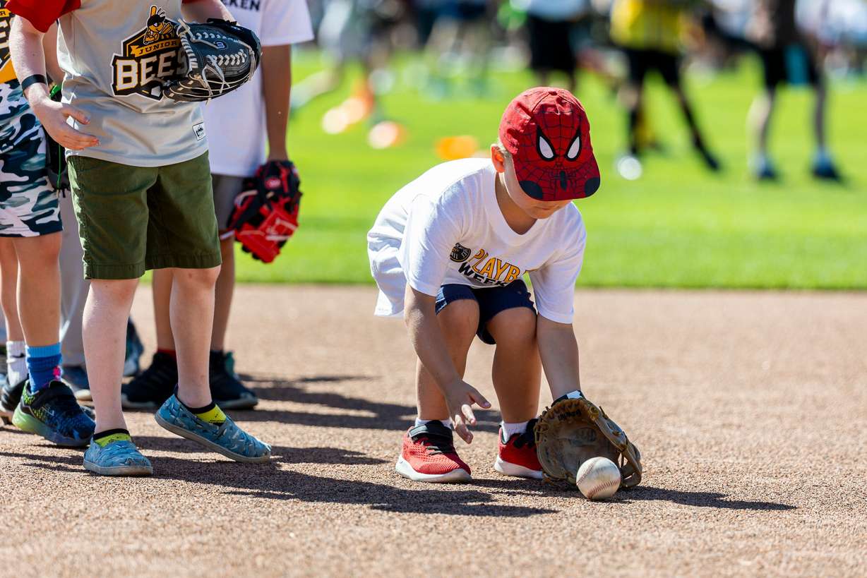 Daniel Black, 6, fields a ground ball as part of activities during a kick-off event for Utah Youth Sports Giving Day held at The Ballpark at America First Square in South Jordan on Friday. The event looks to increase access for youth sports in the state.