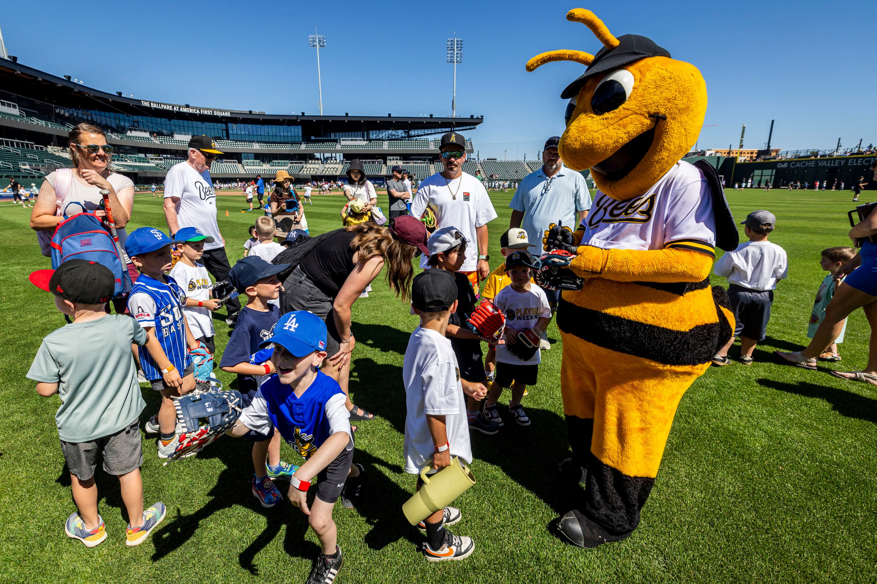 Bumble signs autographs for youth participants during a kick-off event for Utah Youth Sports Giving Day held at The Ballpark at America First Square in South Jordan on Friday. The event looks to increase access for youth sports in the state.