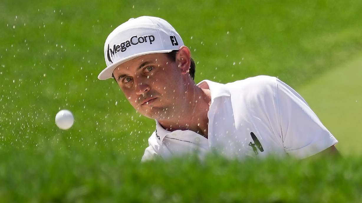 J.T. Poston hits from a bunker to the 18th green during the second round of the Memorial golf tournament in Dublin, Ohio, Friday, June 5, 2026.