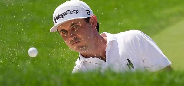 J.T. Poston handles the wind at Memorial for low round of tournament and the lead