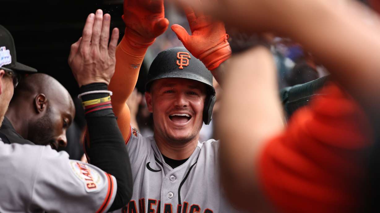 The San Francisco Giants' Matt Chapman celebrates in the dugout after hitting a grand slam during the fourth inning of a baseball game against the Chicago Cubs, Friday, June 5, 2026, in Chicago.