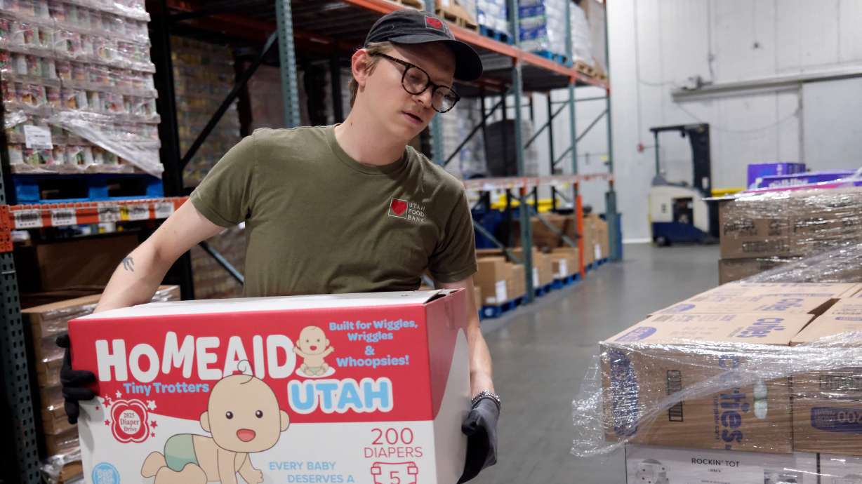 Spencer Gundersen, Utah Food Bank inventory and warehouse coordinator, sorts and organizes diapers for redistribution at the Utah Food Bank in Salt Lake City on Friday. The Food Bank is organizing a diaper drive that starts on June 15.