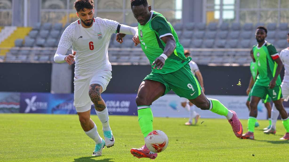 FILE - Nigeria's Akor Adams, right, fights for the ball with Iran's Mohammad Ghorbani during a friendly soccer match between Iran and Nigeria in Antalya, southern Turkey, March 27, 2026.