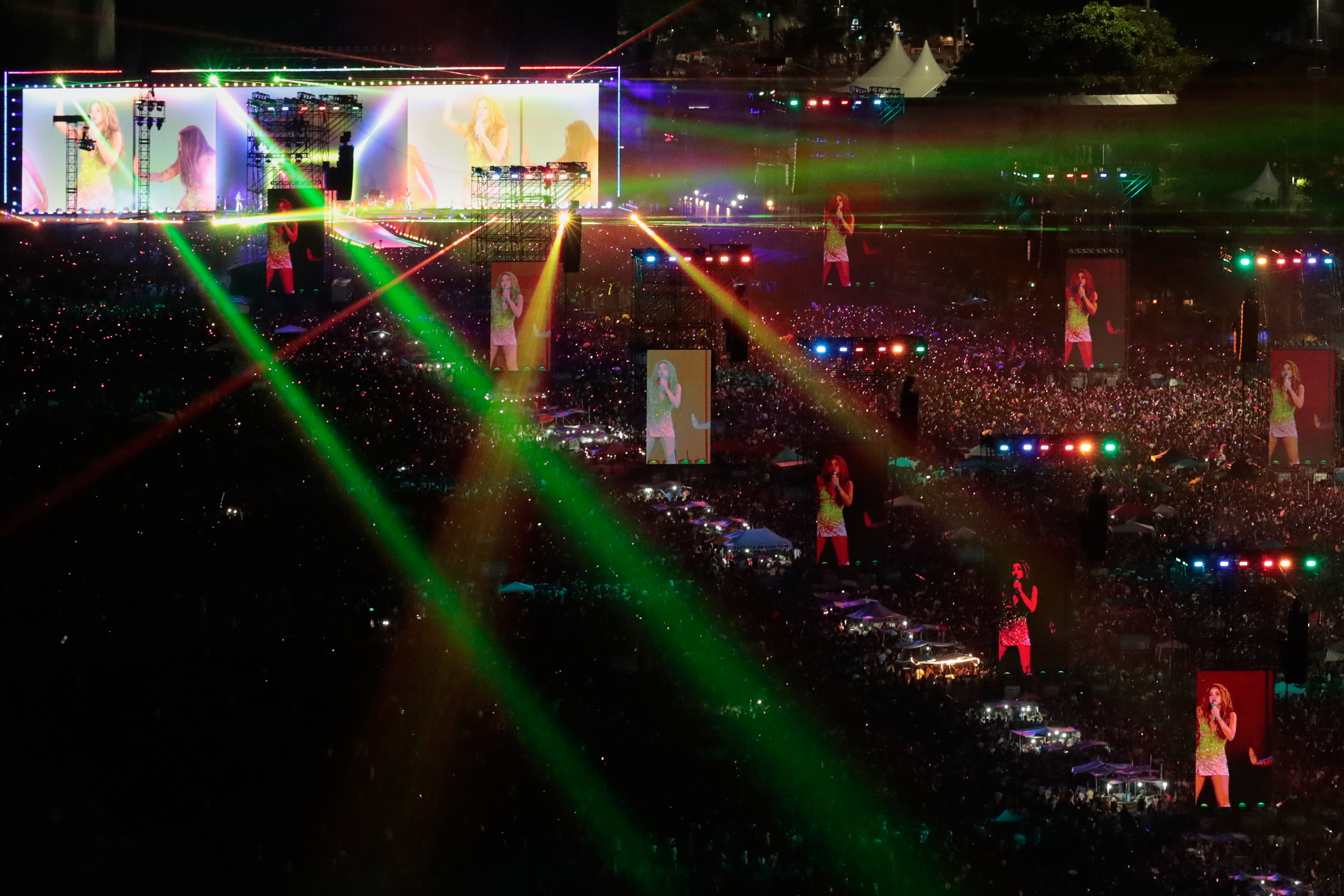 Fans pack the shores of Copacabana Beach to watch a free concert by Shakira in Rio de Janeiro, May 2. Concertgoers are embracing the use of earplugs to protect their hearing at concerts.