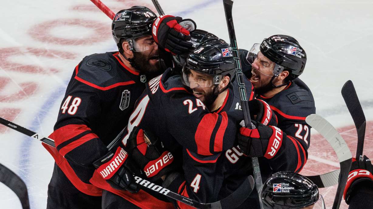 Carolina Hurricanes' Jordan Martinook (48), Seth Jarvis (24), Shayne Gostisbehere (4), and Logan Stankoven (22) ceelbrate after Jarvis scored the game-winning goal against against the Vegas Golden Knights in overtime of Game 2 of the NHL hockey Stanley Cup Final series in Raleigh, N.C., Thursday, June 4, 2026.