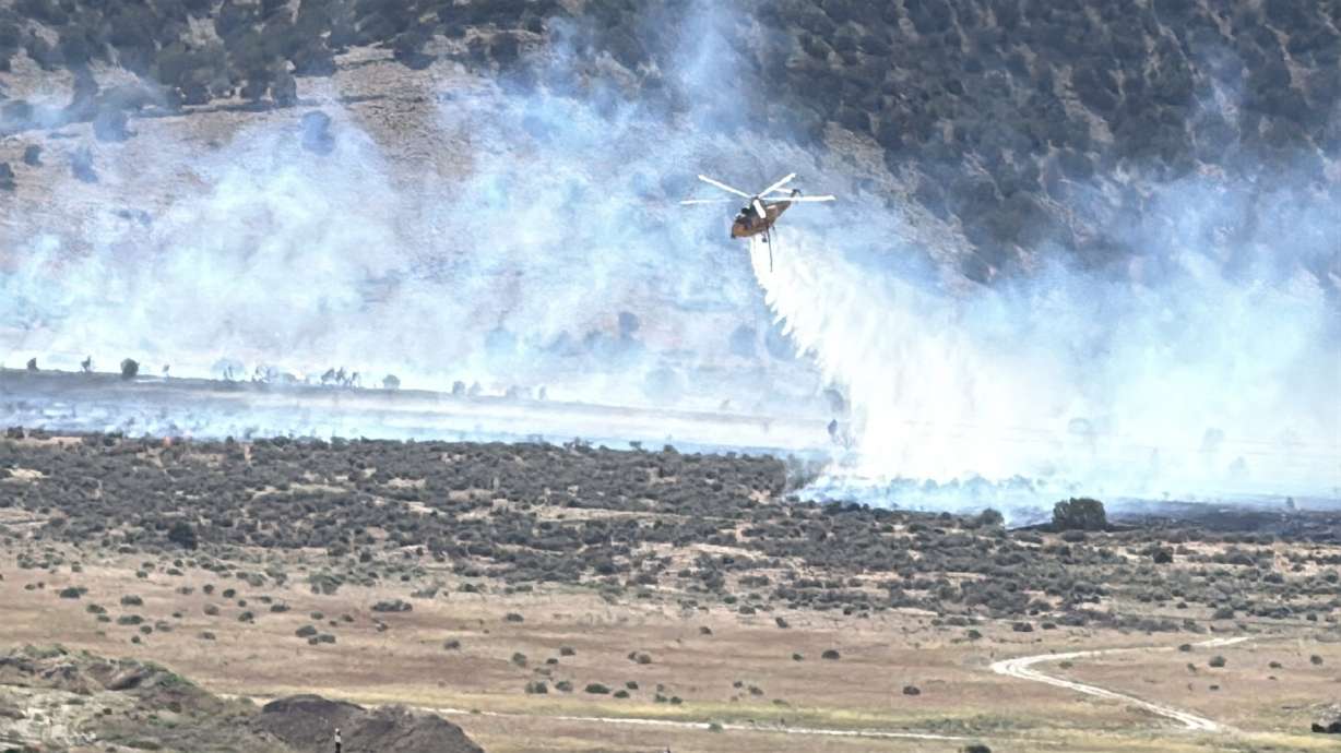 A water drop on the Glamert Lane Fire in Saratoga Springs, Saturday. The fire burned 175 acres and briefly caused an evacuation of homes along Mahogany Road as a precaution.