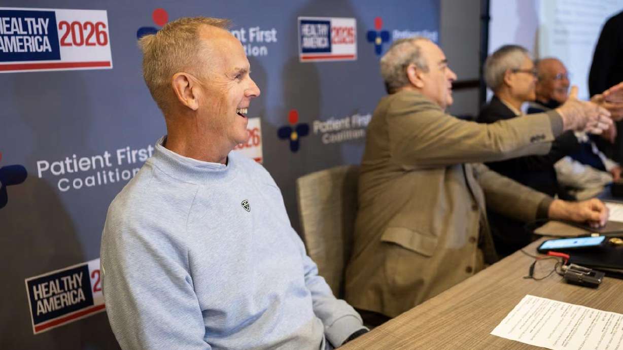 Former BYU and San Francisco 49ers football player Tom Holmoe, left, prepares to speak about red light therapy treatment for CTE with, from left, Scot Faulkner, board member for the Photobiomodulation Foundation; Lew Lim, Vielight founder and CEO; and former BYU football player Larry Carr during the “Healthy America 2026 — Going for the Summit” conference at the Westgate Park City Resort & Spa in Park City on May 5.