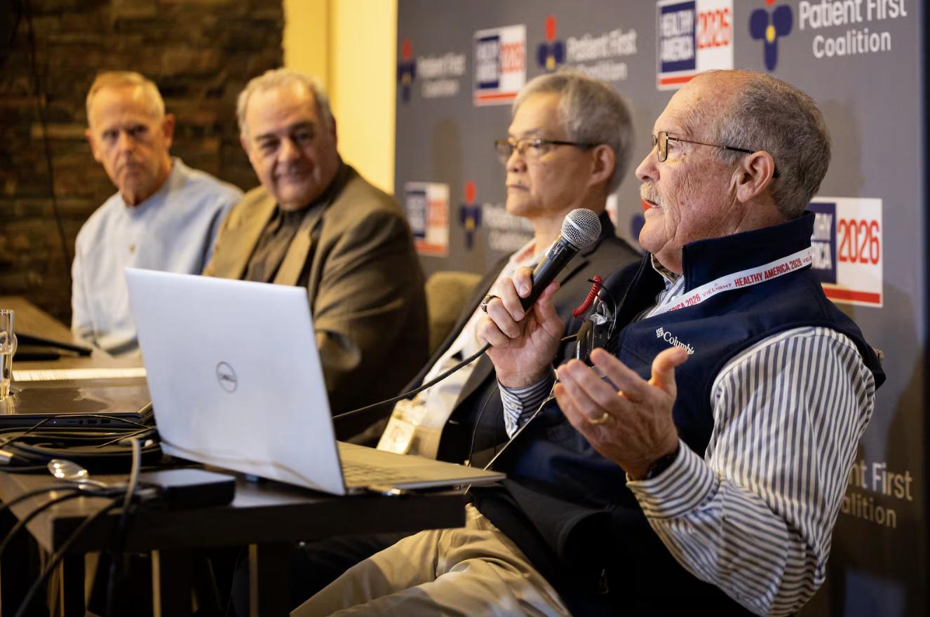 Former BYU football player Larry Carr, right, speaks about red light therapy treatment for CTE with, from left, former BYU and San Francisco 49ers football player Tom Holmoe; Scot Faulkner, board member for the Photobiomodulation Foundation; and Lew Lim, Vielight founder and CEO, during the “Healthy America 2026 — Going for the Summit” conference at the Westgate Park City Resort & Spa in Park City on May 5.