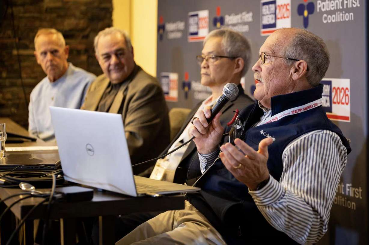Former BYU football player Larry Carr, right, speaks about red light therapy treatment for CTE with, from left, former BYU and San Francisco 49ers football player Tom Holmoe; Scot Faulkner, board member for the Photobiomodulation Foundation; and Lew Lim, Vielight founder and CEO, during the “Healthy America 2026 — Going for the Summit” conference at the Westgate Park City Resort & Spa in Park City on May 5.