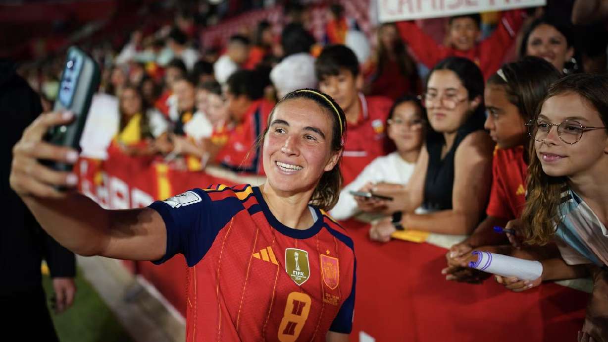 Spain's Mariona Caldentey poses for a selfie with fans at the end of the 2027 Women's World Cup qualifying soccer match between Spain and England in Mallorca, Spain, Friday.