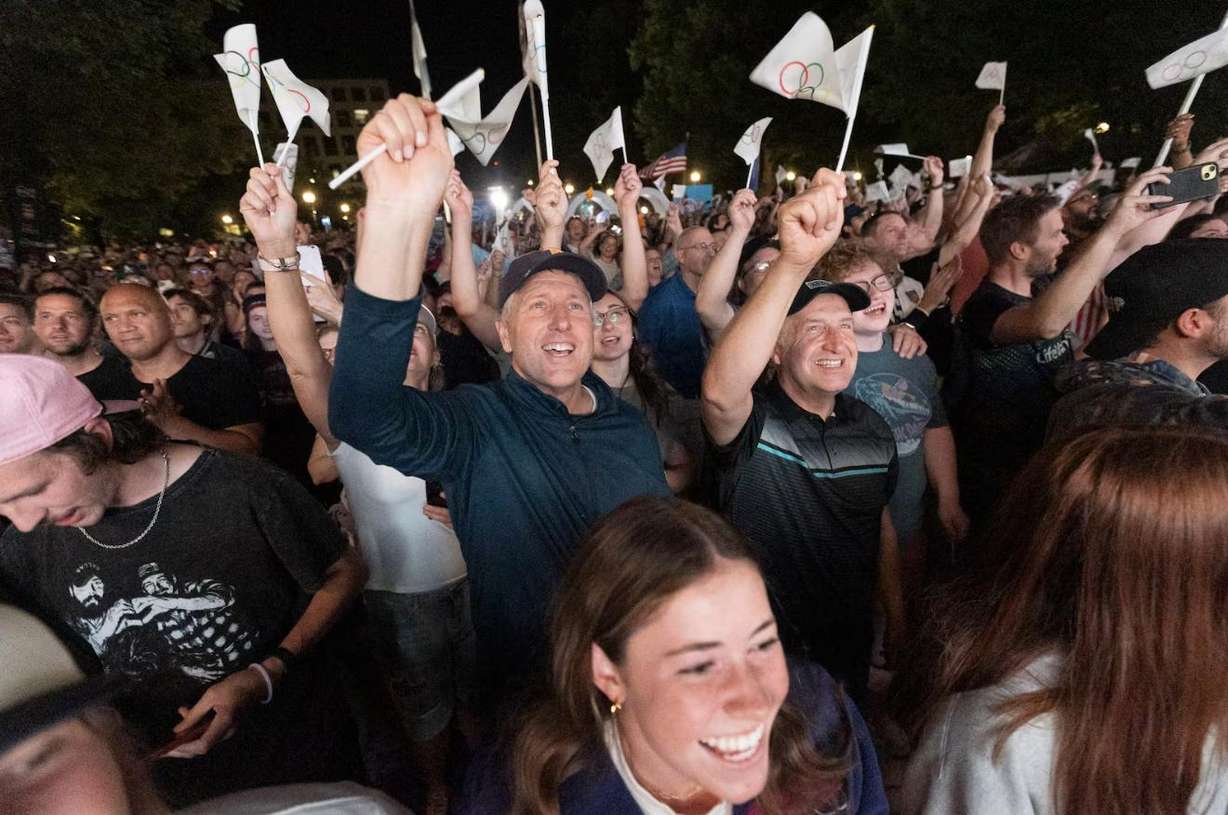 Attendees cheer after the International Olympic Committee awarded the 2034 Winter Olympic Games to the Salt Lake City-Utah Committee during a live watch party held at the Salt Lake City and County Building in Washington Square Park on July 24, 2024, in downtown Salt Lake City.