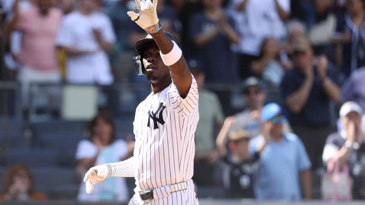 New York Yankees' Jazz Chisholm Jr. reacts after hitting a three-run home run, leading Trent Grisham and Anthony Volpe to also score, during the eighth inning of a baseball game against the Boston Red Sox, Sunday, June 7, 2026, in New York.