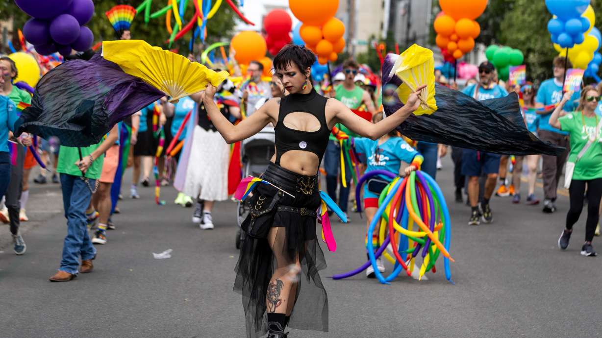 People march during the Utah Pride Parade in downtown Salt Lake City on Sunday.