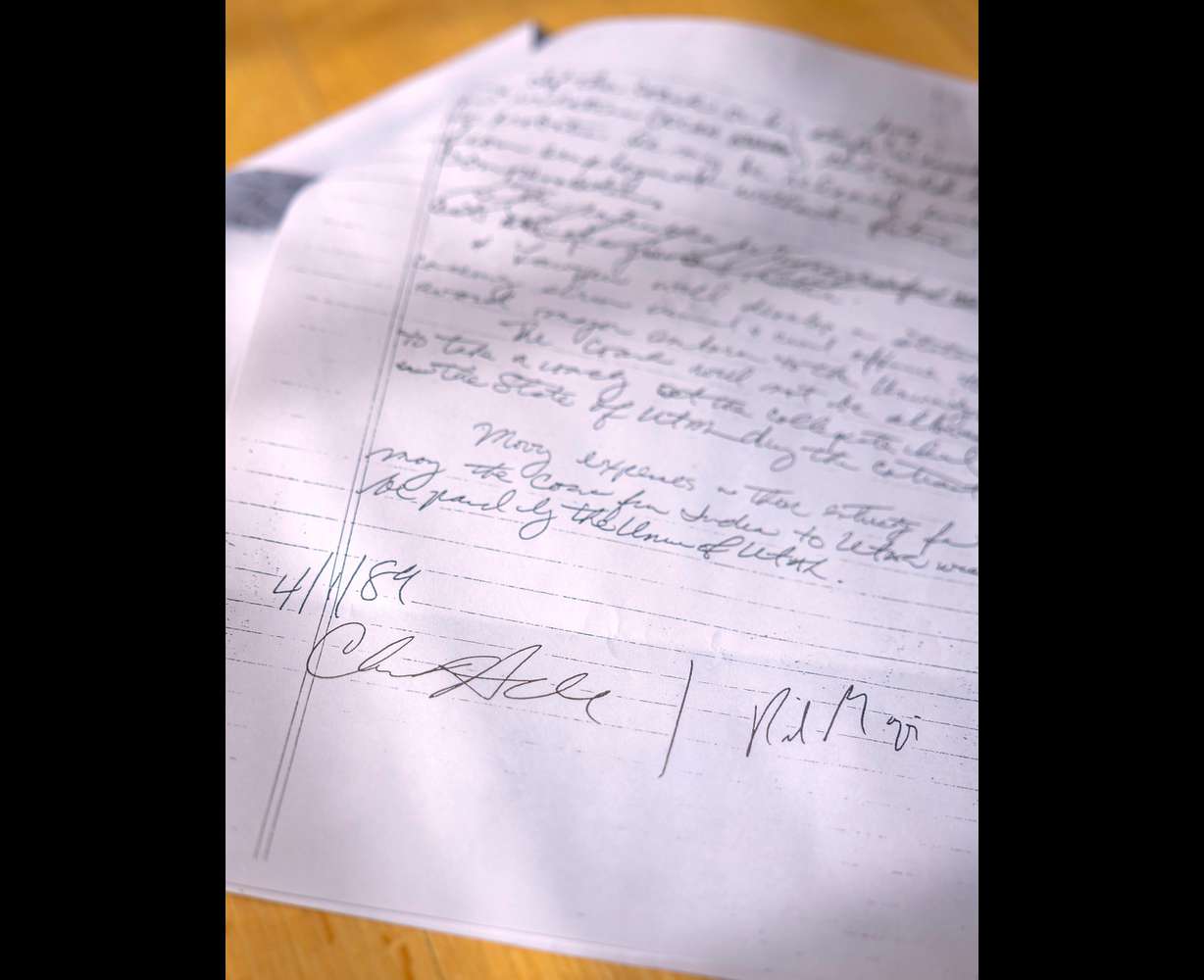 A contract between Chris Hill and Rick Majerus at Hill’s home in Salt Lake City on March. Hill was athletic director at the University of Utah from 1987 to 2018, and hired Majerus to coach the men’s basketball team in 1989.