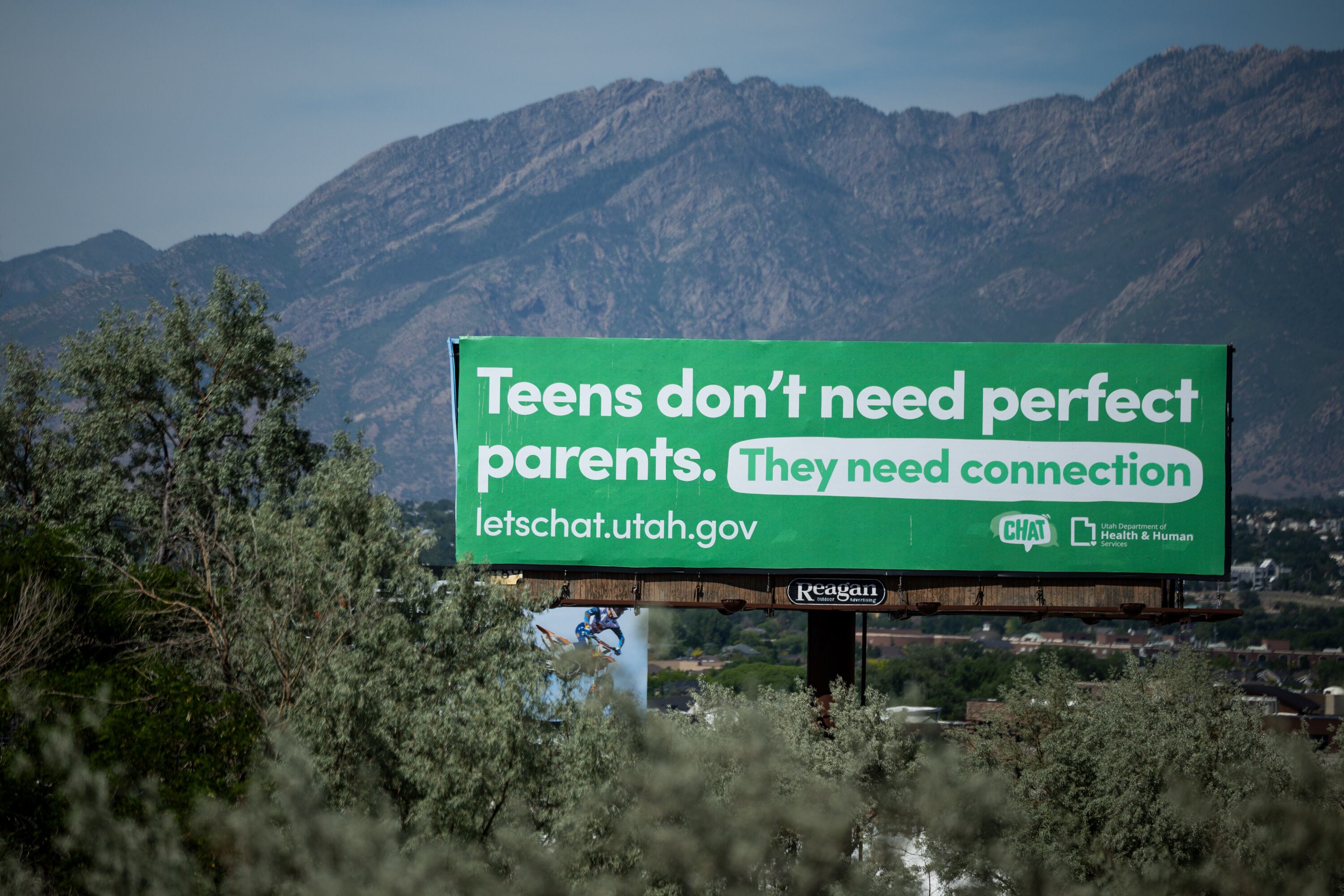 A LetsChat Utah billboard is seen off I-15 near Draper in Point of the Mountain on June 2. The billboard is part of the CHAT initiative to get Utah parents to build connections with their children.