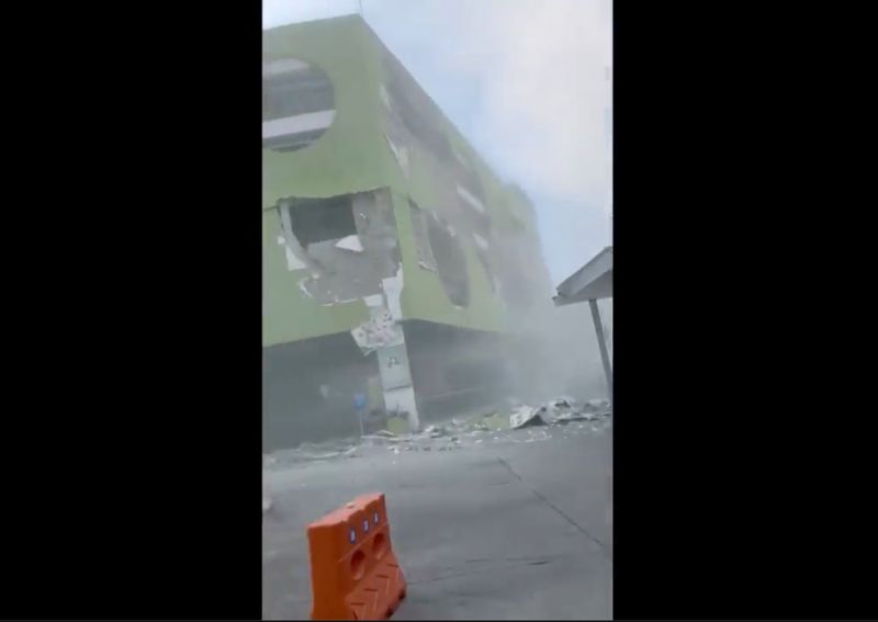 This image from a video shows dust and debris outside a building after a powerful earthquake in General Santos city on the island of Mindanao, Philippines on Monday.