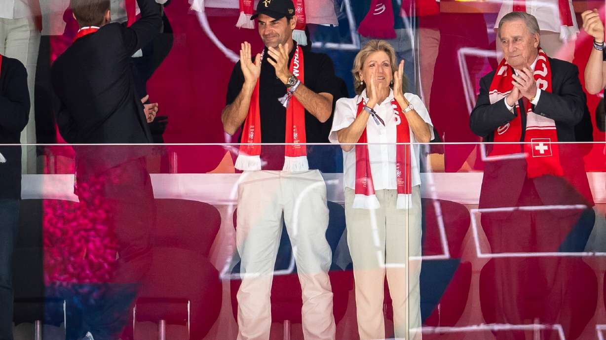 Former professional tennis player Roger Federer, left, and his mother Lynette Federer celebrate after Switzerland won the quarterfinal game between Switzerland and Sweden at the men's ice hockey world championship in Zurich, Switzerland, Thursday, May 28, 2026.
