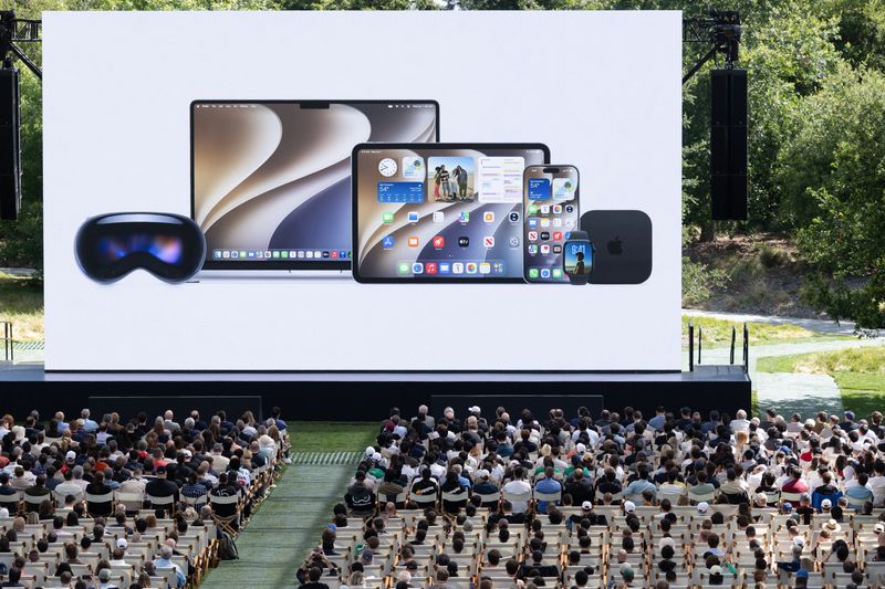 Attendees watch a presentation during Apple's annual Worldwide Developers Conference in Cupertino, Calif., Monday.