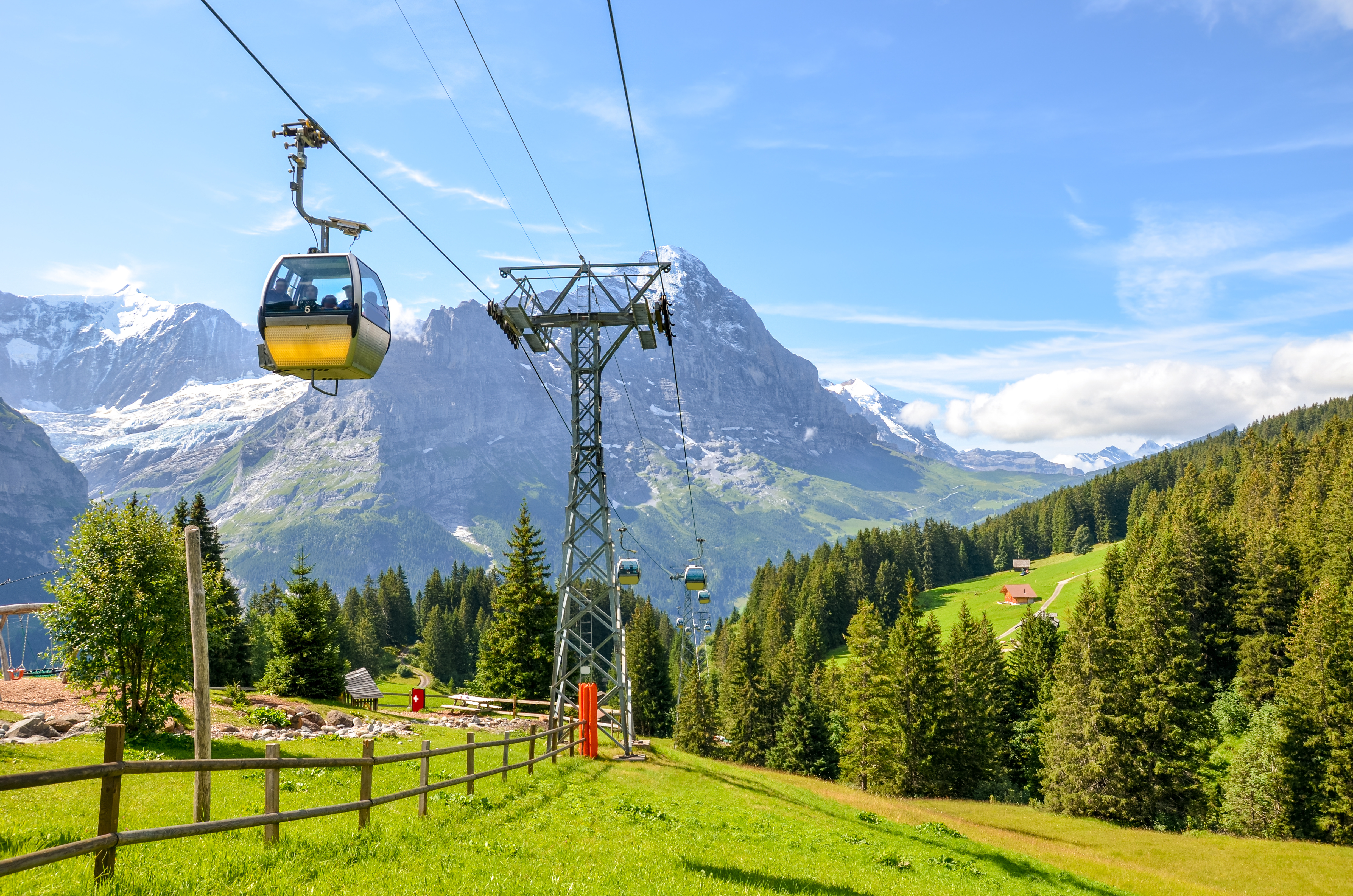 Yellow cable car in the Swiss Alps. Gondola going from Grindelwald to First in the Jungfrau area.