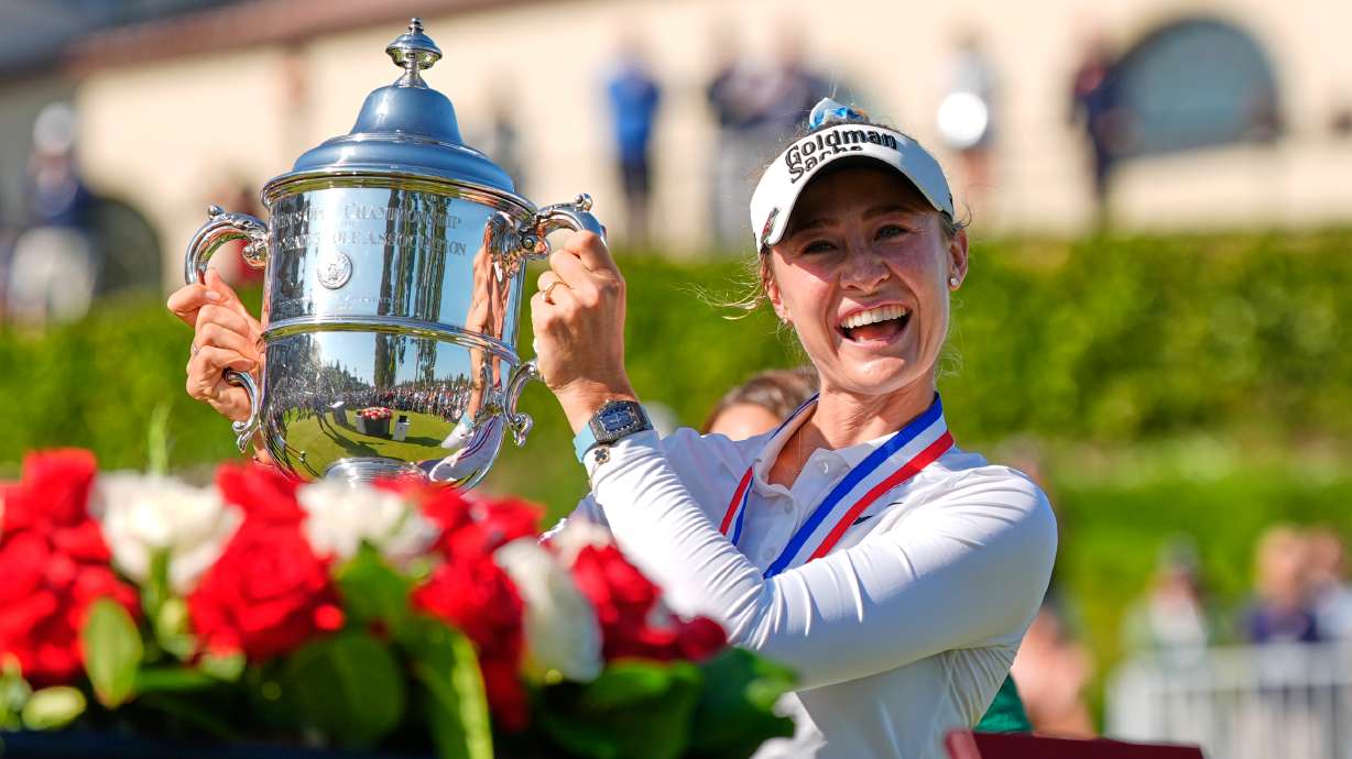 Nelly Korda holds up the trophy after winning the U.S. Women's Open golf tournament Sunday, June 7, 2026, in the Pacific Palisades area of Los Angeles.