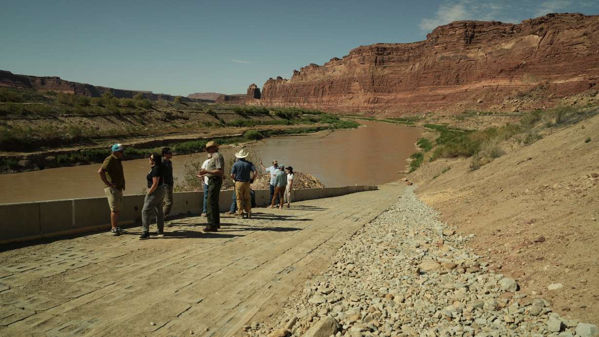 People explore the new temporary North Wash ramp in the Cataract Canyon area of Lake Powell near Hite, San Juan County, on Thursday. The ramp is now open.
