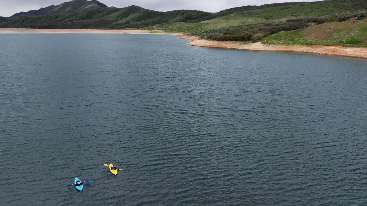 Kayakers move through Little Dell Reservoir as Utah experiences a statewide drought on May 21. Utah's reservoir system is now 68% full statewide, down from 86% this time last year.